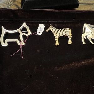 Jewelry three pins $6 each, cow, zebra, dog, golden, fake gold.!